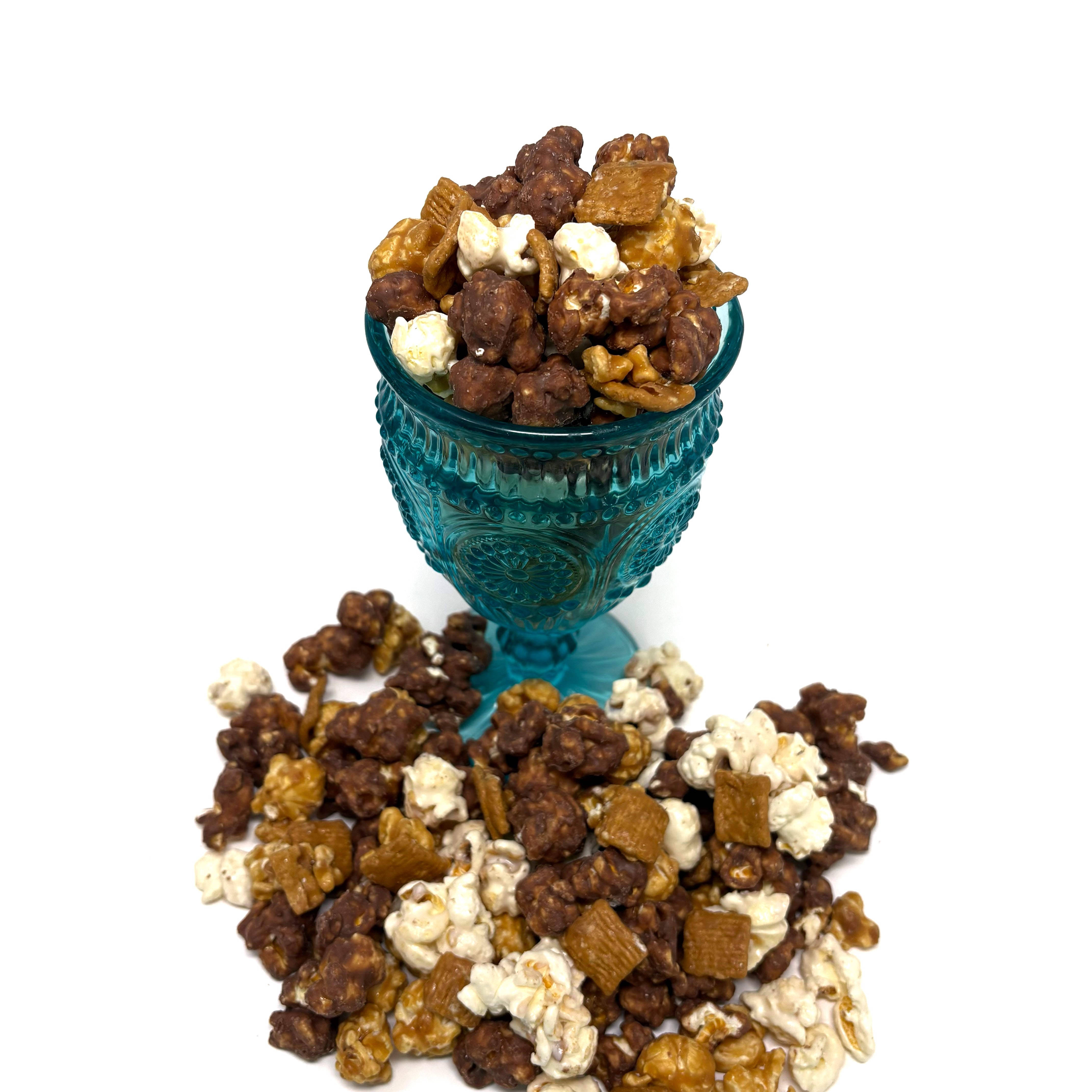Ultimate S'more popcorn includes our salted vanilla caramel popcorn tossed with gooey s’mores chocolate, golden toasted marshmallows, and crunchy bits of Golden Grahams cooked right in with our caramel.