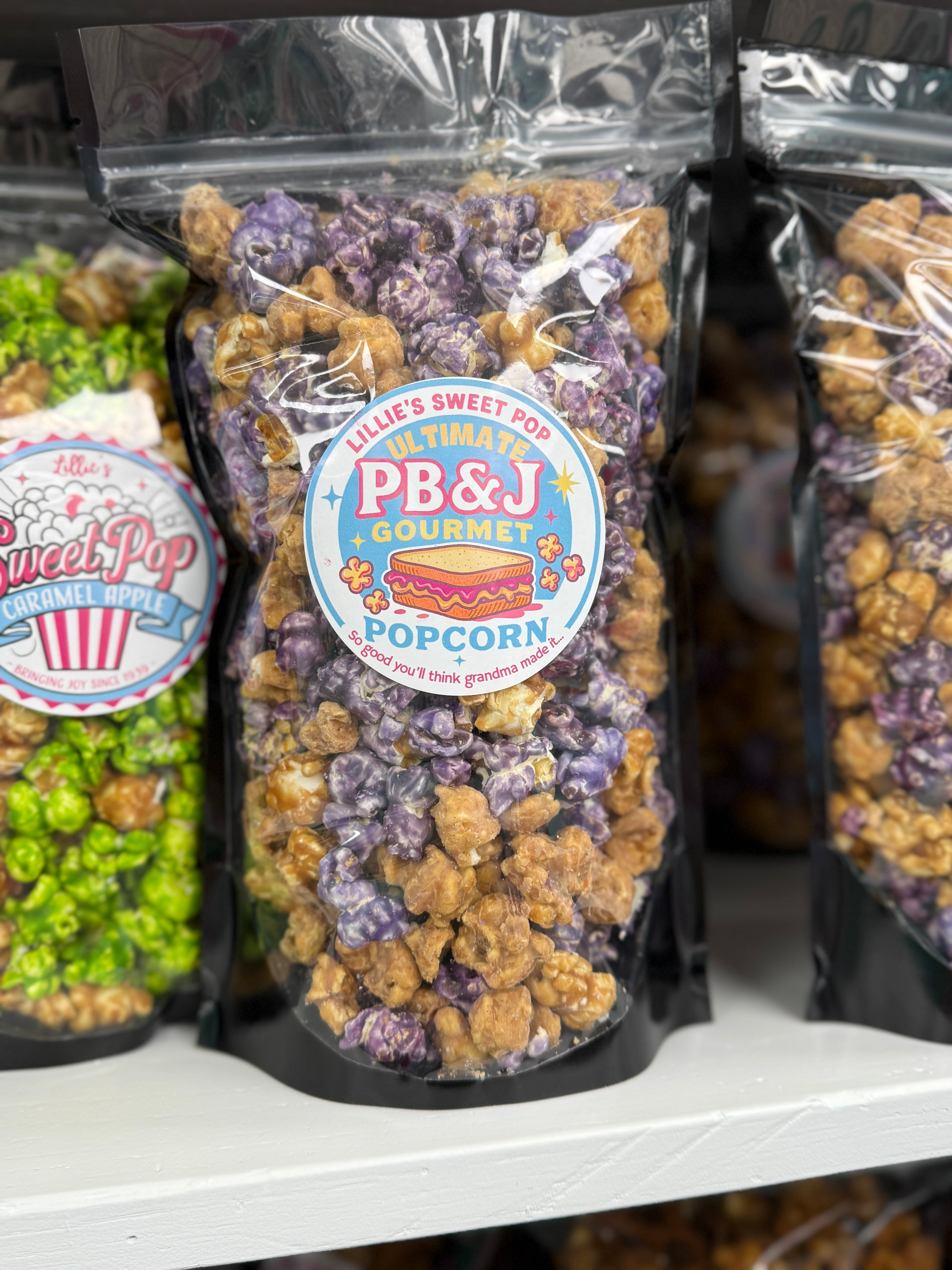 Our Jam Session - PB & J Peanut Butter Popcorn combines bold grape-flavored popcorn with our Ultimate Peanut Butter Cup popcorn (rich chocolate + creamy peanut butter), all tumbled together with buttery salted caramel popcorn.