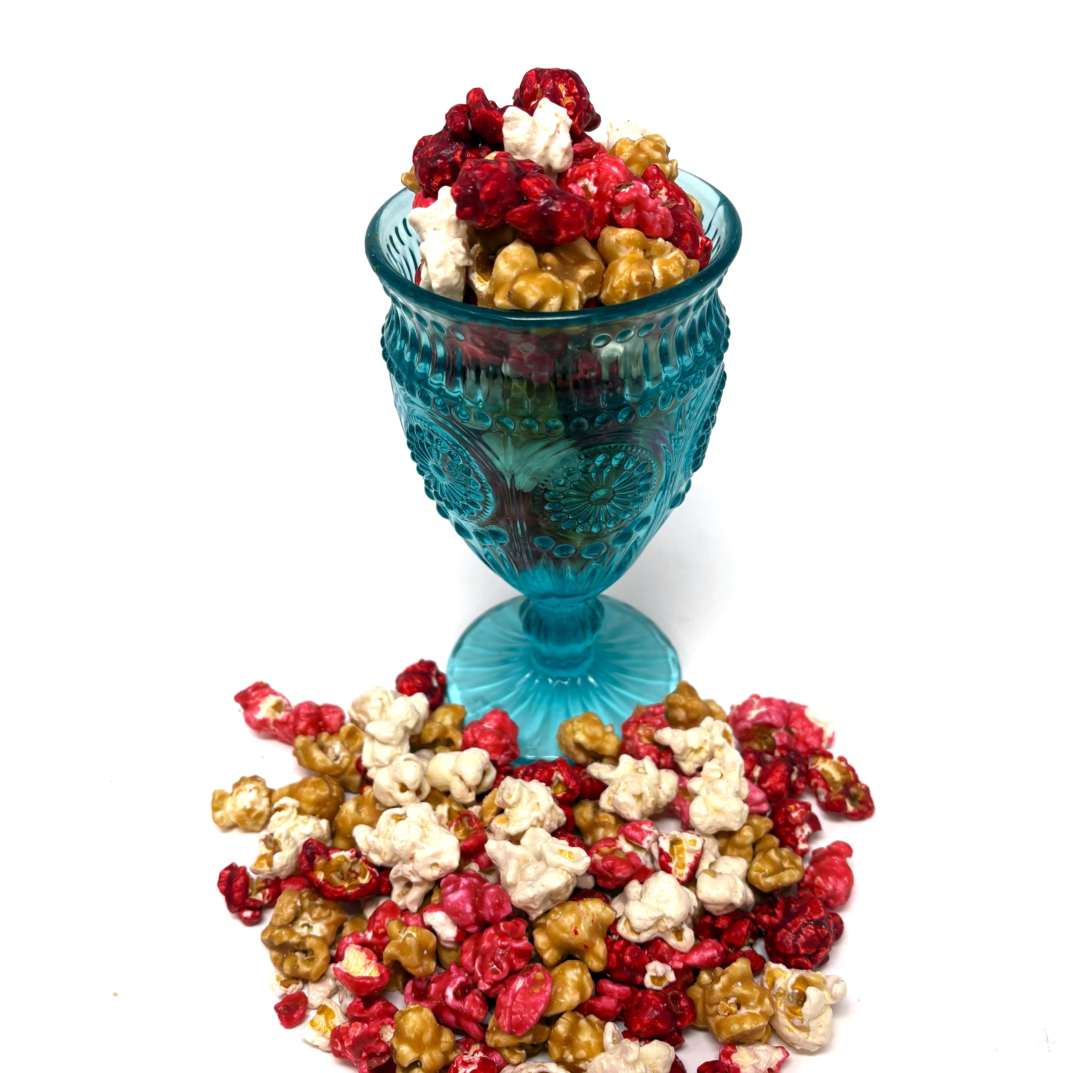 Our Just Bloomed Popcorn combines the fruity fresh flavors of raspberry, strawberry, and cherry with the rich flavors of vanilla and vanilla salted caramel popcorn.