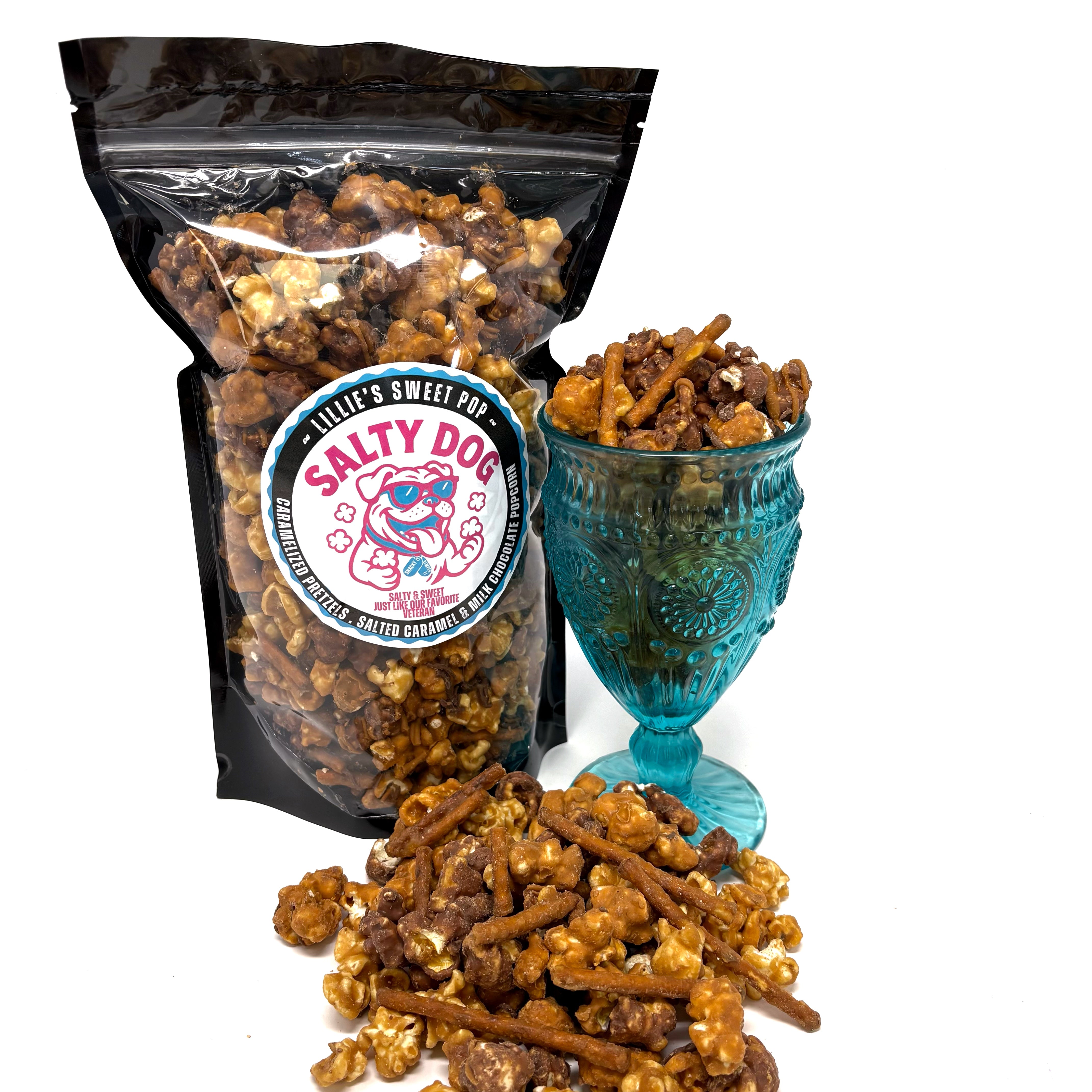 Salty Dog has salted vanilla caramel popcorn immersed in milk chocolate paired with our classic salted vanilla caramel popcorn. Finished off with a drizzle of sea salt chocolate and caramel-coated pretzels.