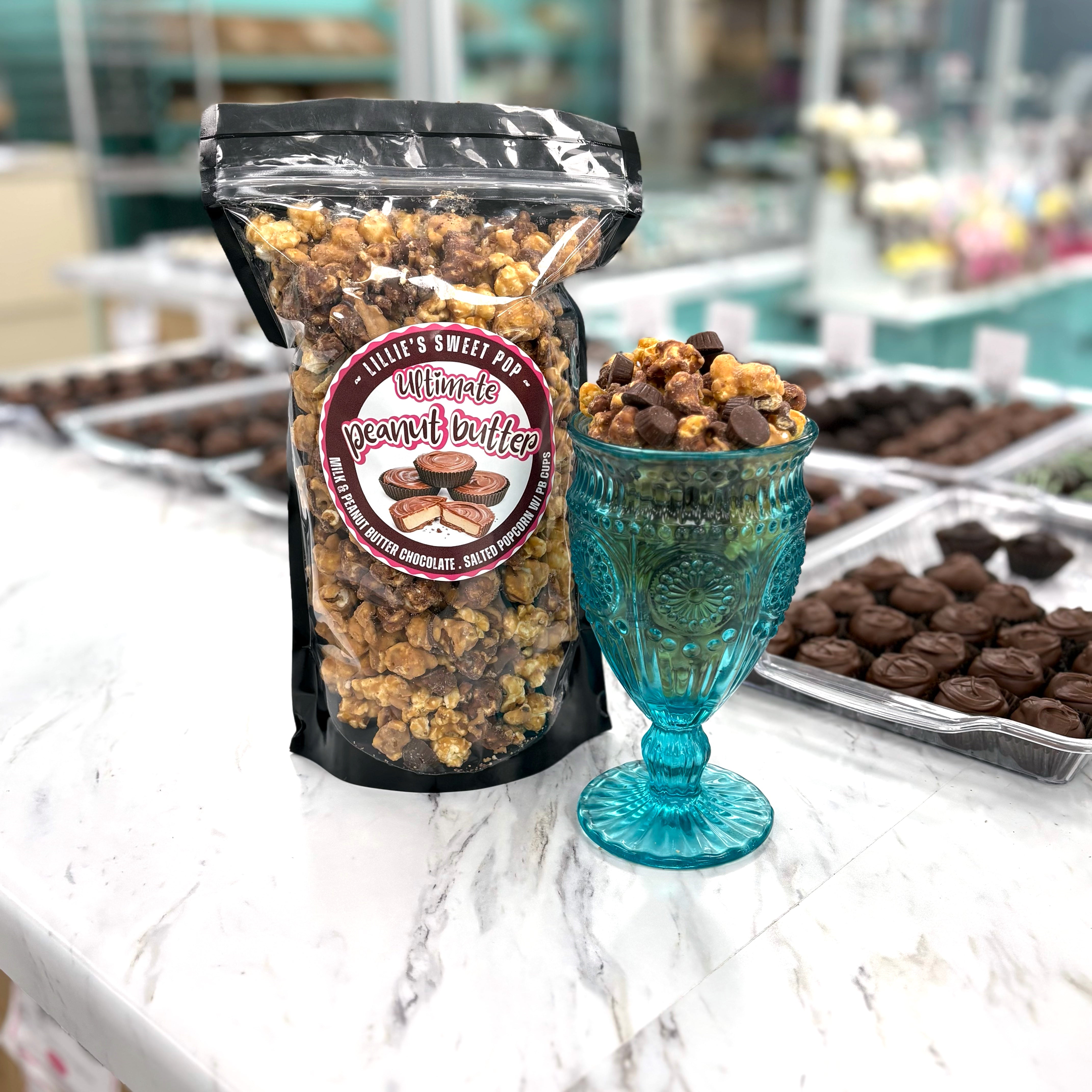 Our Ultimate Peanut Butter Cup Popcorn  includes a blend of milk chocolate popcorn, peanut butter chocolate popcorn, and salted vanilla popcorn. Finished off with mini peanut butter cups sprinkled throughout.